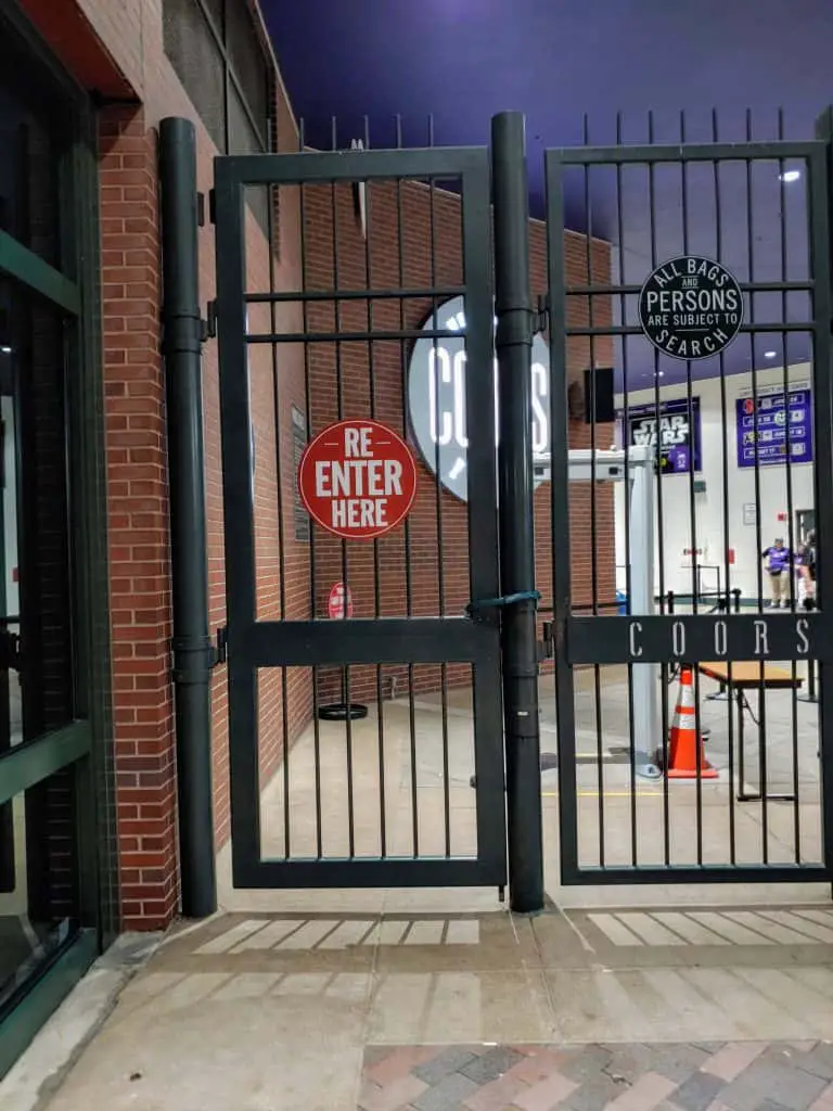 re-enter here sign on the gate at coors field