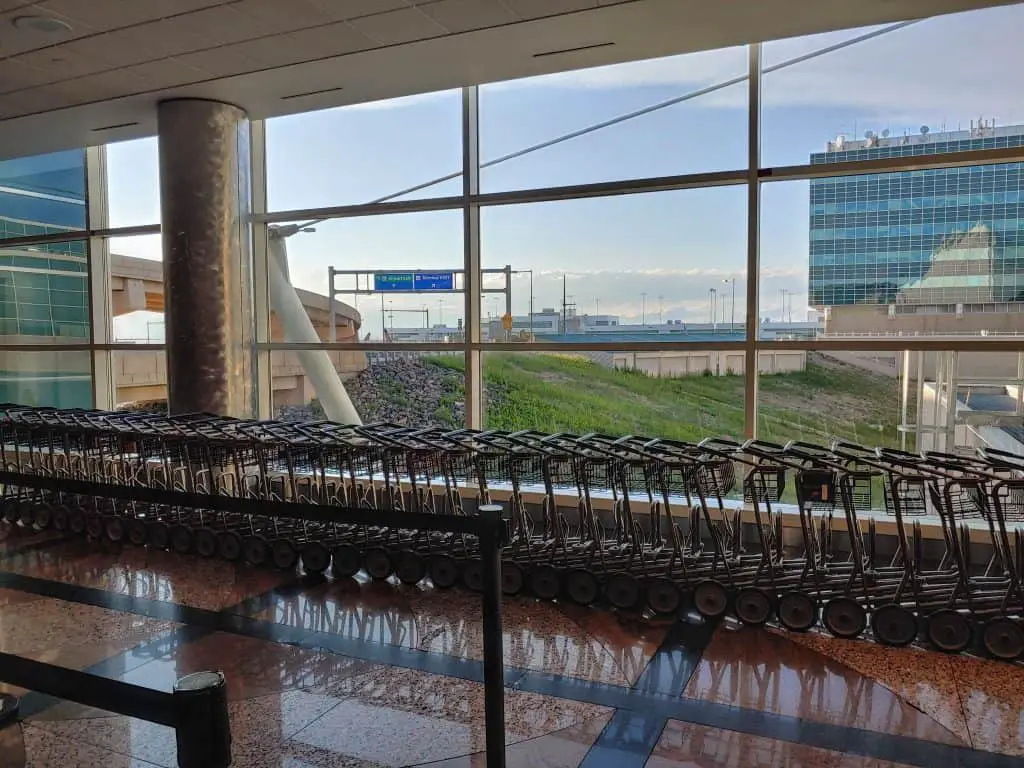  Denver International Airport  luggage carts with a window in the background