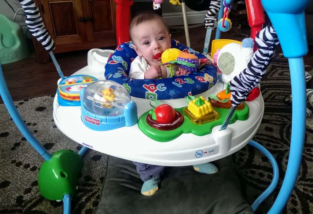 baby in an exersaucer