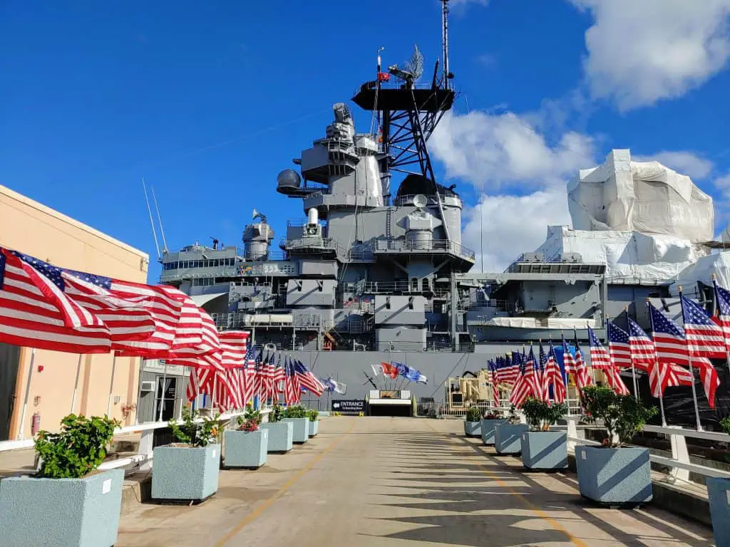 Battleship Missouri in the dock with American Flags