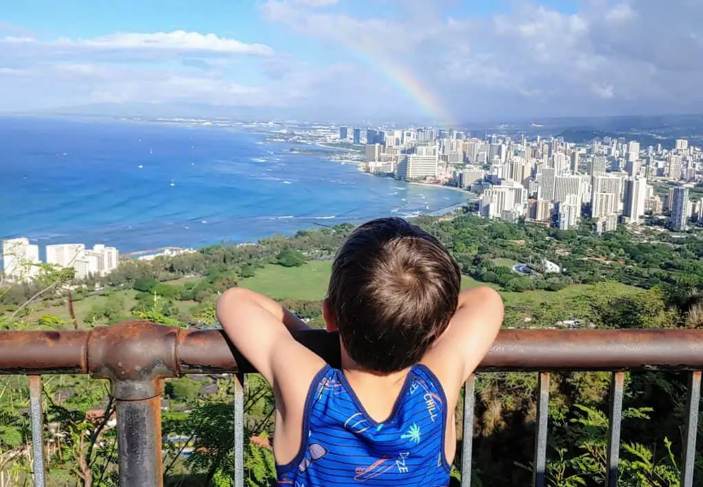 Boy looking out over Honolulu from Diamond Head