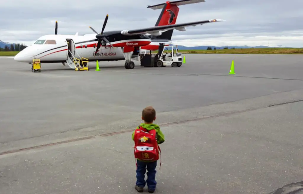 Child in front of an airplane