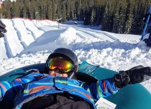 boy at the top of the tubing hill in keystone