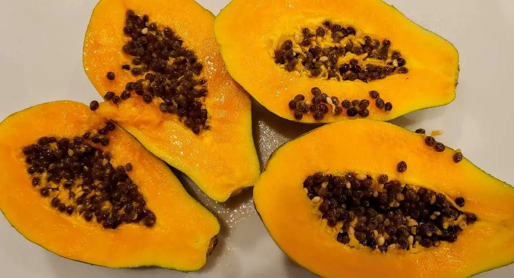 Papaya cut open with the seeds still in the middle - Fruit in Hawaii