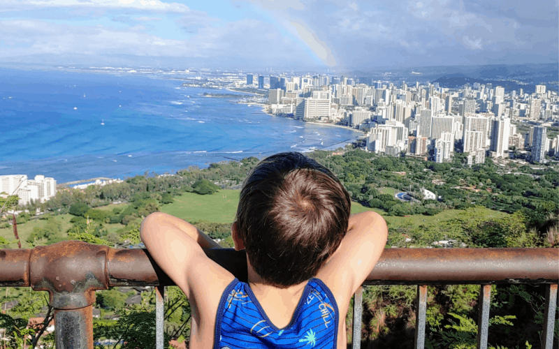 Boy looking at the view of Honolulu Hawaii