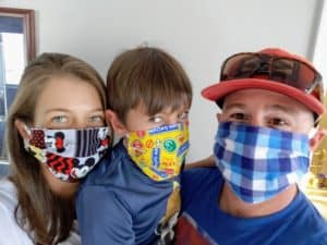 Family of 3 wearing face masks
