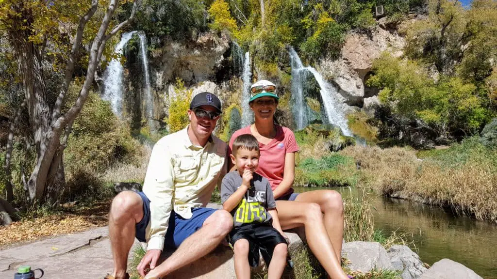 Family sitting in front of Rifle Falls