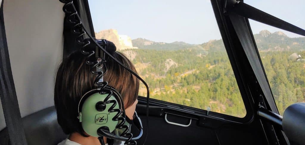 Child in a helicopter on a tour of the Black Hills of South Dakota