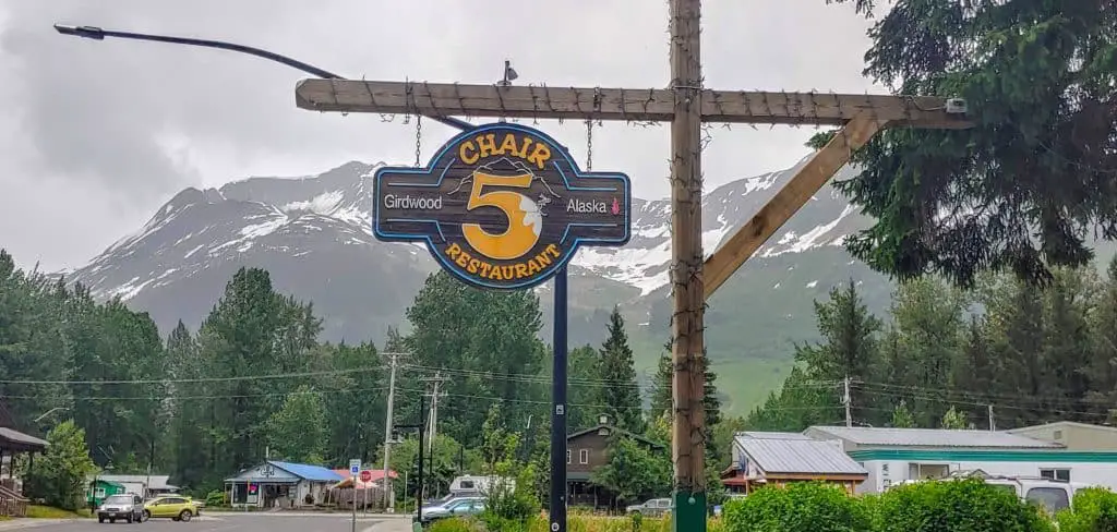 Chair 5 Restaurant sign with Alyeska Resort in the background in Girdwood, Alaska