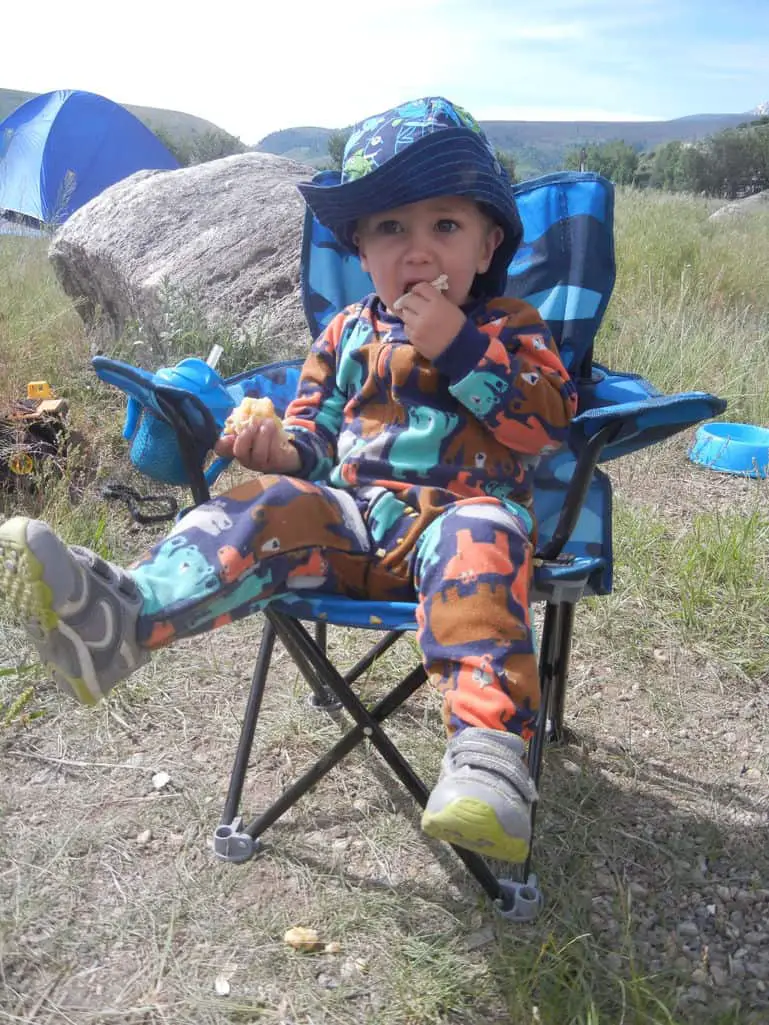 small boy in a camp chair - an essential when camping with kids