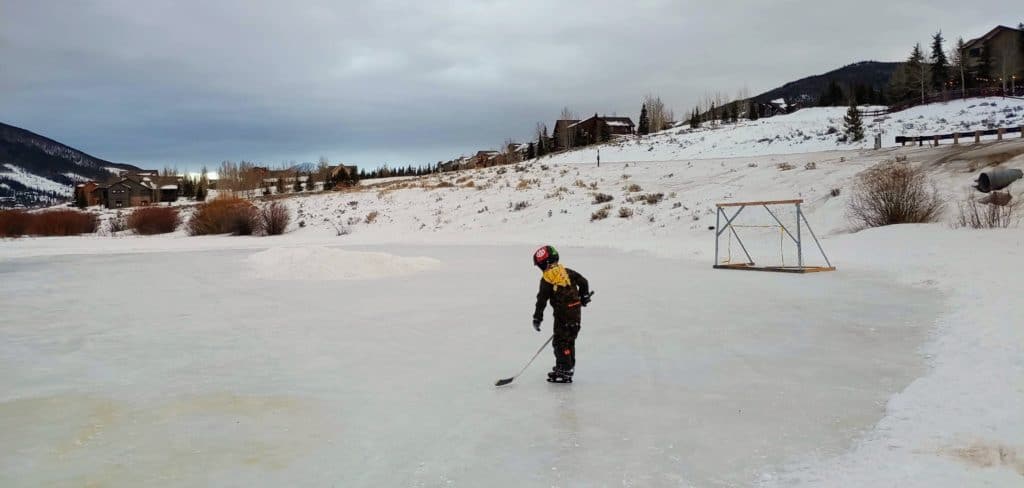 Boy ice skating near Breckenridge Colorado