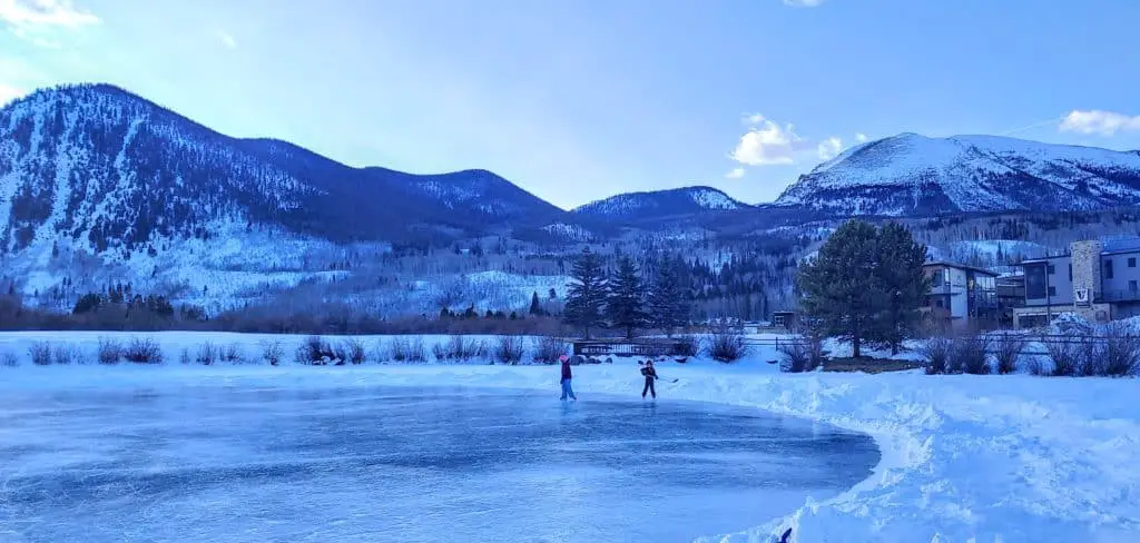 Kids Ice Skating on Meadow Creek Pond in Frisco, Colorado