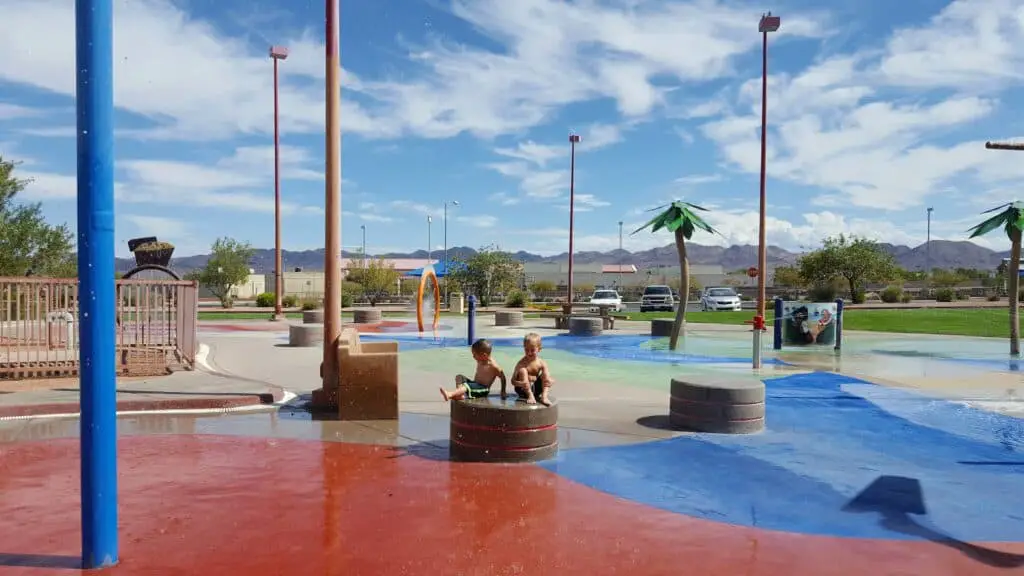 Kids playing at one of the many splash pad parks in Las Vegas