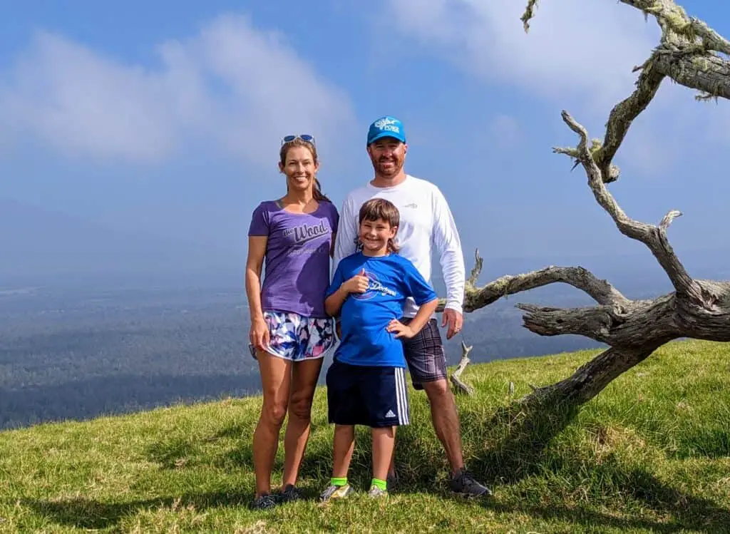 family standing on top of a cinder cone on the Island of Hawaii