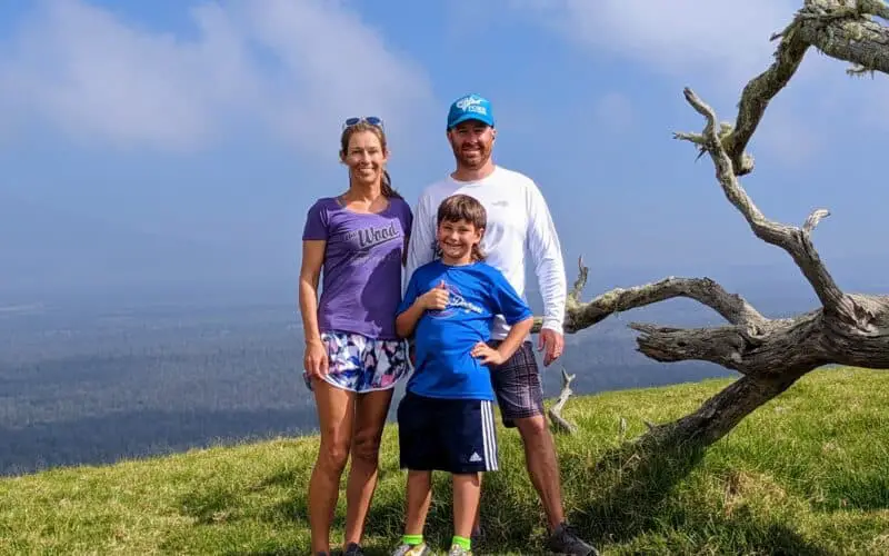 family standing on top of a cinder cone on the Island of Hawaii
