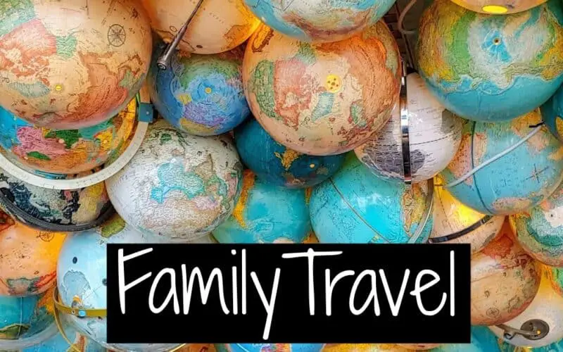 Many globes with the words Family Travel